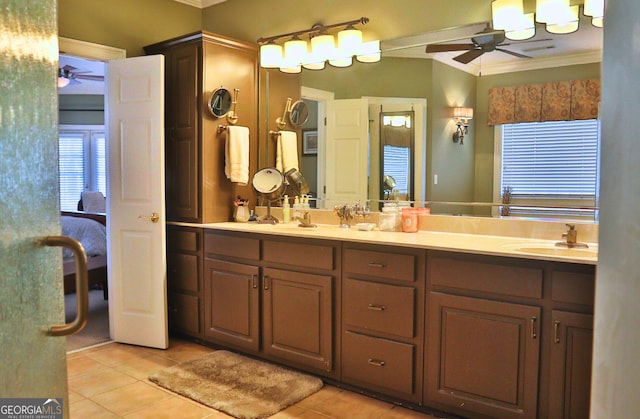 full bath featuring tile patterned flooring, a sink, a ceiling fan, and crown molding