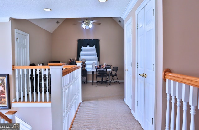 interior space with carpet, vaulted ceiling, baseboards, and recessed lighting