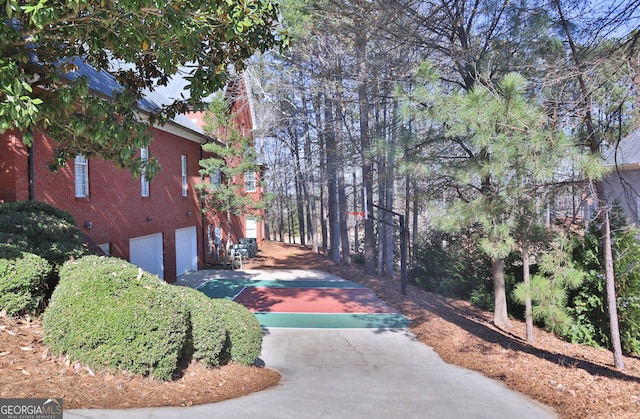 exterior space featuring driveway and an attached garage