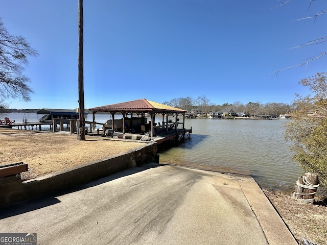 dock area with a water view and a gazebo