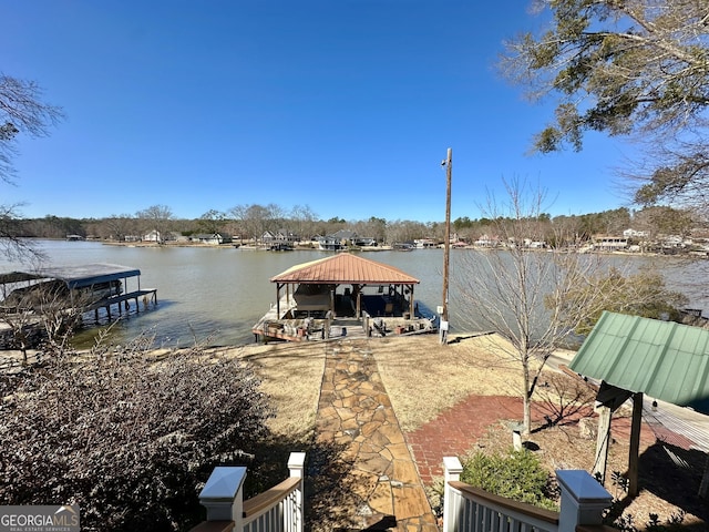 view of dock with a water view and a gazebo