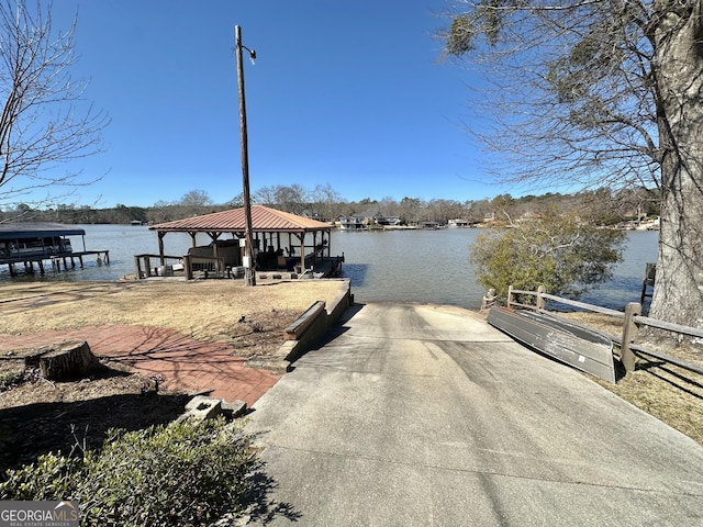 dock area with a water view and a gazebo