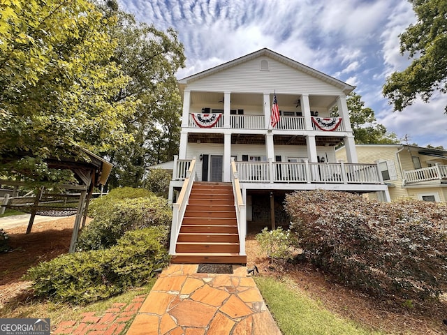 375 Templeton Cir, Mansfield, GA 30055 - view of front of property featuring a balcony, stairs, a porch, and ceiling fan