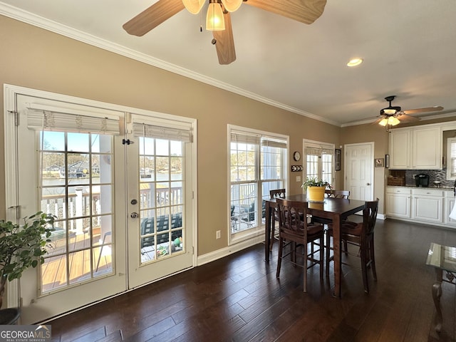 dining space featuring recessed lighting, dark wood-style flooring, crown molding, and baseboards