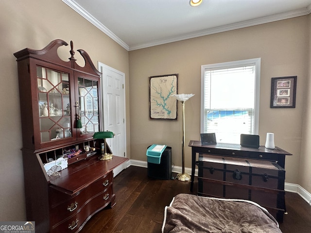 sitting room featuring baseboards, ornamental molding, and dark wood-type flooring