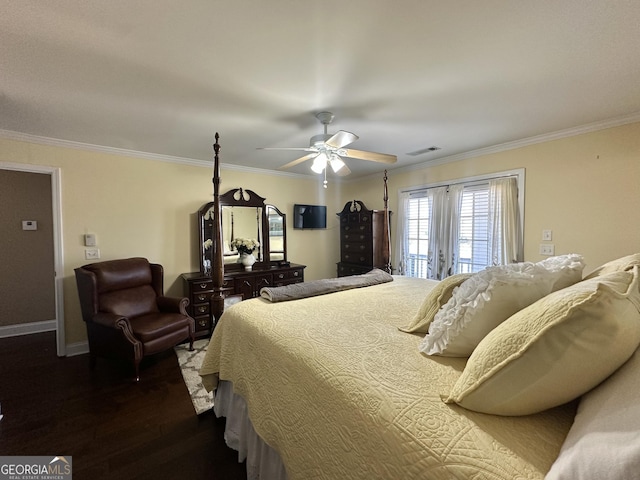 bedroom featuring dark wood-style flooring, visible vents, crown molding, and baseboards