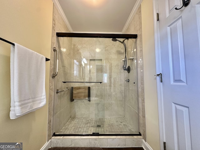 full bath with a stall shower and crown molding