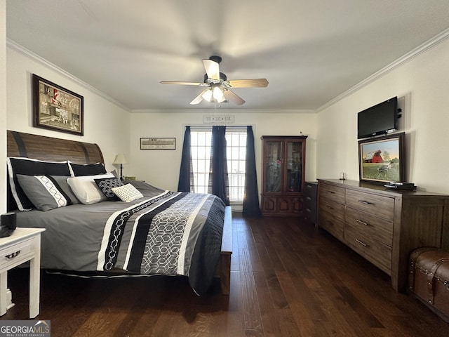 bedroom with ornamental molding, dark wood-style flooring, and a ceiling fan