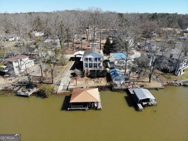 birds eye view of property featuring a water view