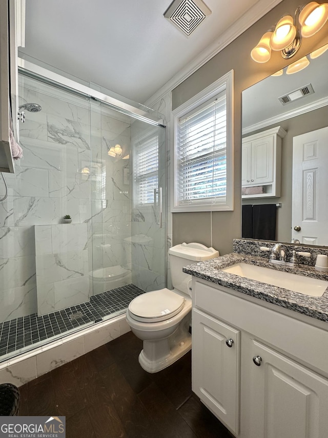 375 Templeton Cir, Mansfield, GA 30055 - full bathroom featuring toilet, vanity, crown molding, and a marble finish shower