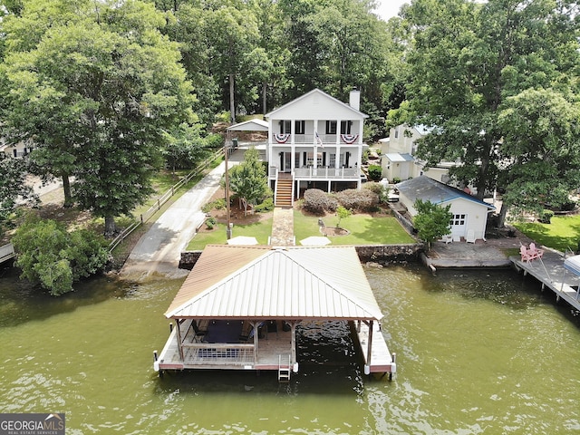 375 Templeton Cir, Mansfield, GA 30055 - dock area featuring a water view, a lawn, and stairs
