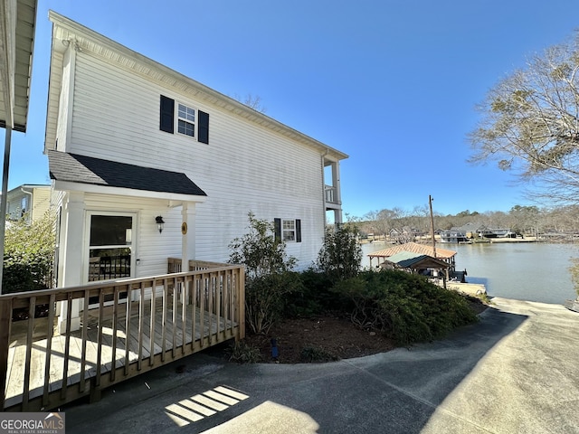 view of property exterior featuring a water view