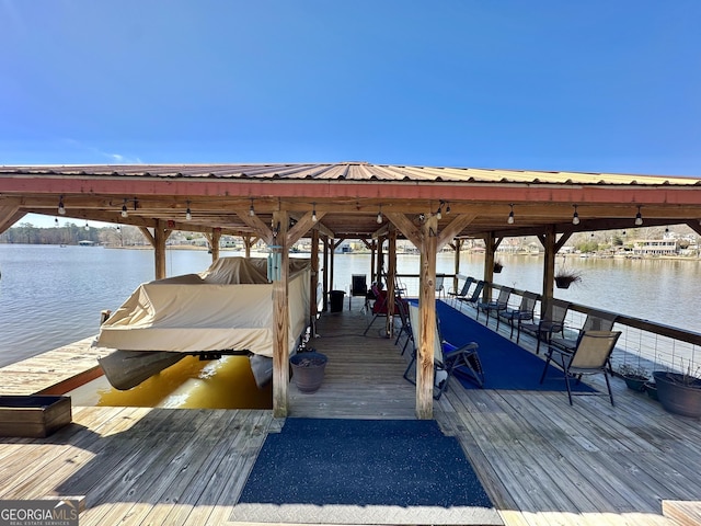 dock area featuring a water view and boat lift