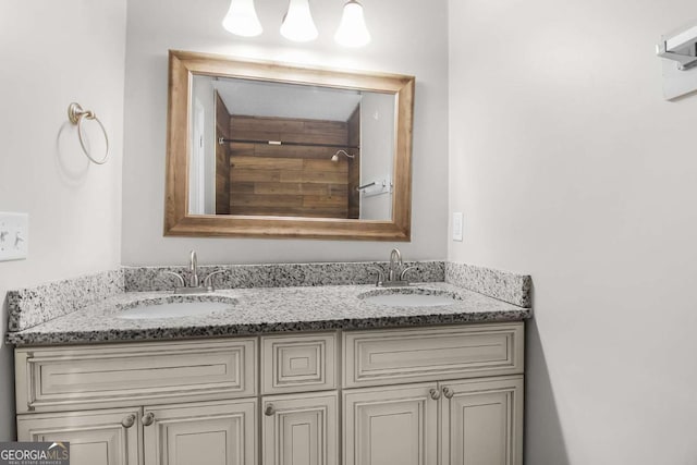 full bath with a sink and double vanity