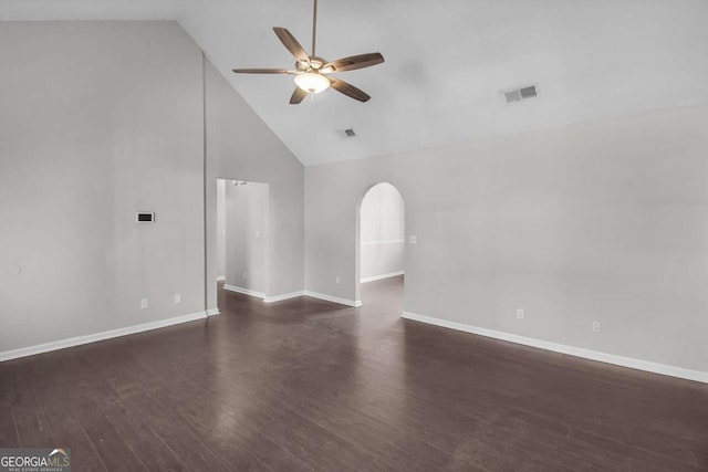 unfurnished living room featuring a ceiling fan, arched walkways, visible vents, and wood finished floors