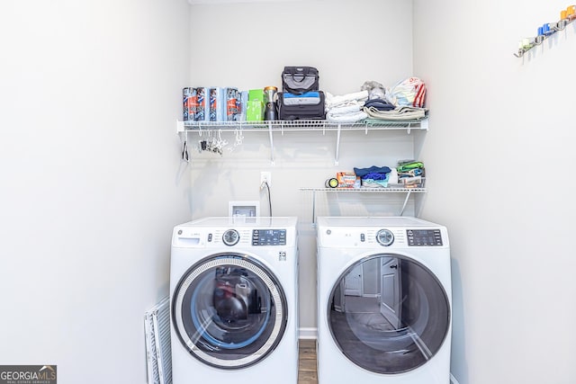 laundry room with laundry area and separate washer and dryer