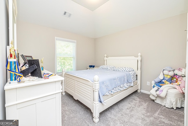 bedroom featuring light carpet, visible vents, and baseboards