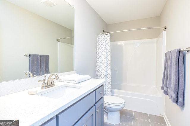 bathroom featuring tile patterned flooring, toilet, vanity, visible vents, and shower / bath combination with curtain