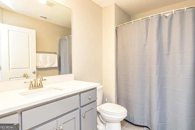 full bath featuring toilet, tile patterned flooring, visible vents, and vanity