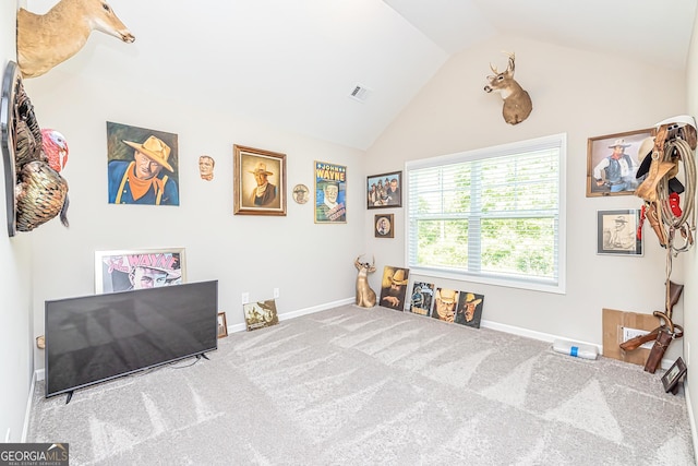 playroom featuring carpet floors, lofted ceiling, visible vents, and baseboards