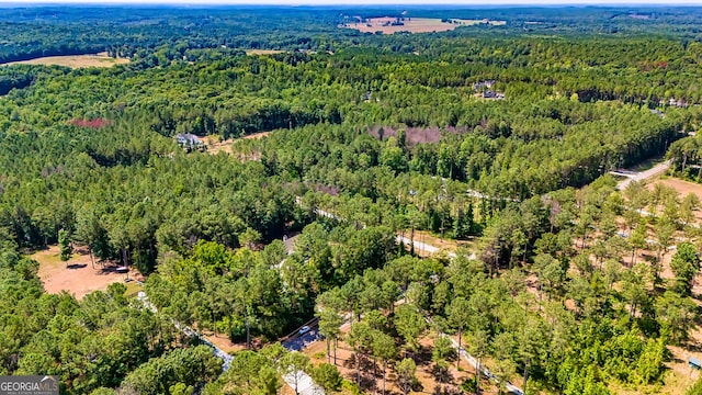 aerial view featuring a view of trees