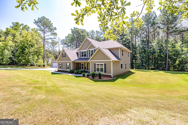 craftsman house featuring a garage and a front yard