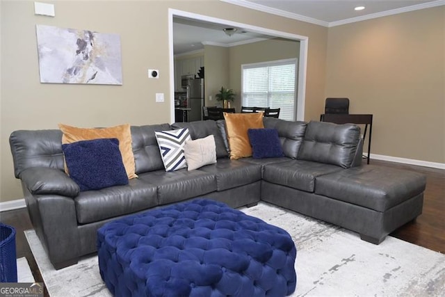 living area featuring ornamental molding, recessed lighting, wood finished floors, and baseboards