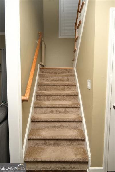 staircase with baseboards