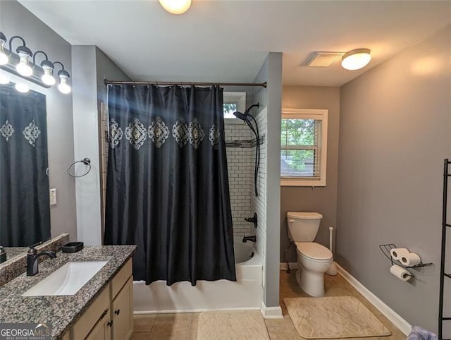 full bathroom with tile patterned flooring, toilet, vanity, visible vents, and shower / tub combo with curtain