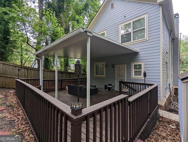 wooden deck featuring fence and outdoor lounge area