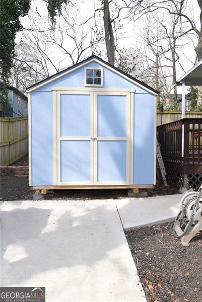 view of shed with a fenced backyard