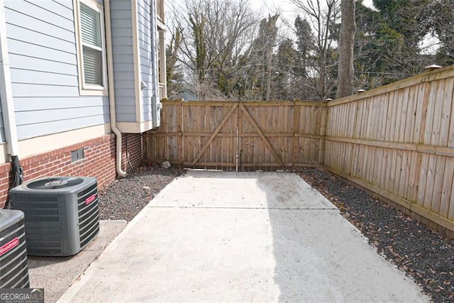 view of patio / terrace with a fenced backyard and cooling unit