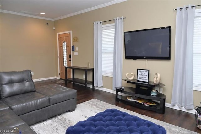 living room featuring ornamental molding, recessed lighting, baseboards, and wood finished floors