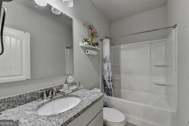 full bathroom with toilet, shower / tub combo with curtain, and vanity