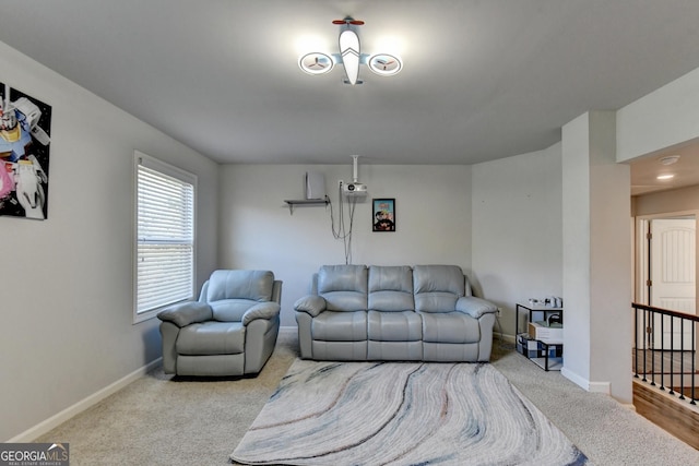 carpeted living room with baseboards