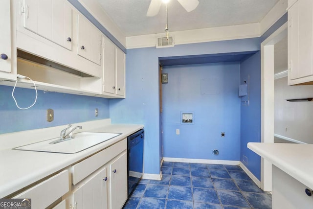 kitchen with visible vents, dishwasher, light countertops, white cabinetry, and a sink