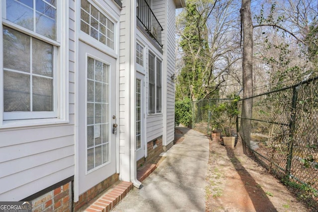 view of property exterior featuring fence