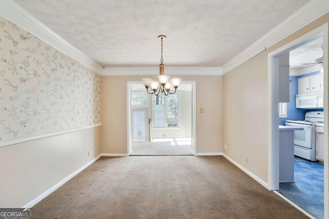 unfurnished dining area with a textured ceiling, carpet floors, and ornamental molding