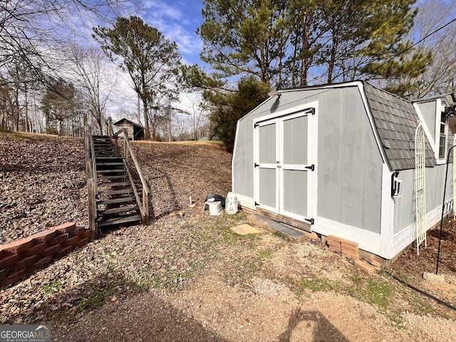 view of shed featuring stairs