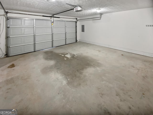 parking garage featuring baseboards, electric panel, and a garage door opener