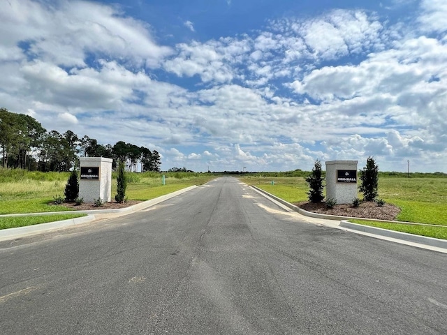 view of street featuring curbs