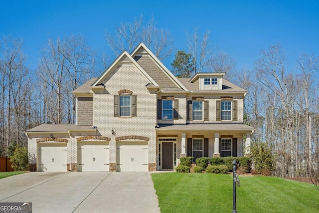 view of front of home with a front lawn, concrete driveway, and brick siding