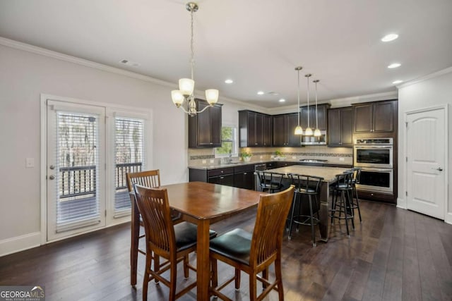 dining space featuring baseboards, ornamental molding, dark wood-style flooring, and recessed lighting