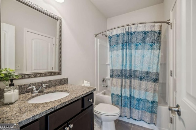 full bathroom featuring toilet, shower / bath combo with shower curtain, vanity, and tile patterned floors