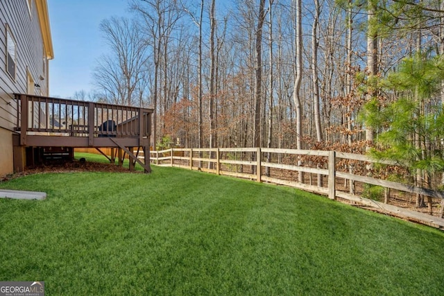 view of yard with stairway, fence, and a wooden deck