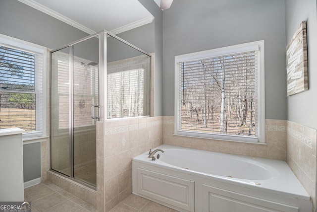 full bathroom featuring a stall shower, tile patterned flooring, and a healthy amount of sunlight