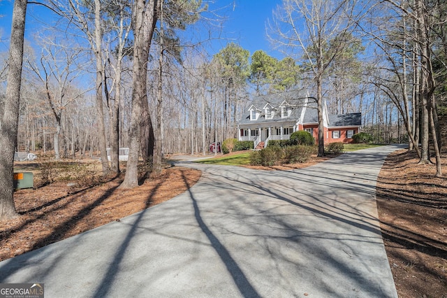 view of street featuring aphalt driveway