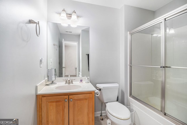 full bath with bath / shower combo with glass door, visible vents, toilet, vanity, and tile patterned flooring