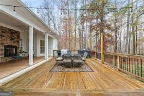 wooden terrace with outdoor dining space