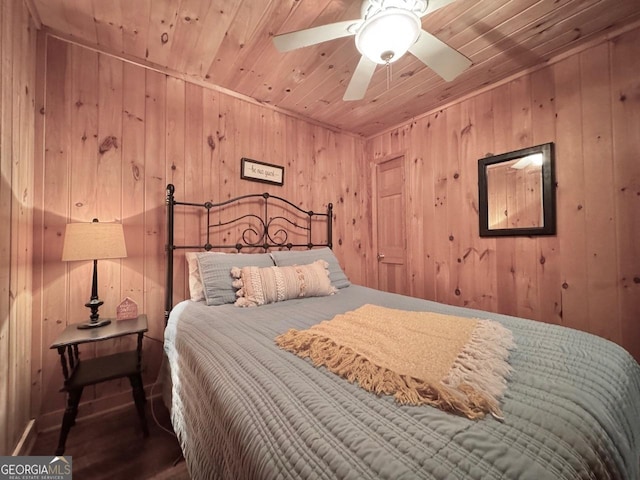 bedroom with wood ceiling, wooden walls, and wood finished floors